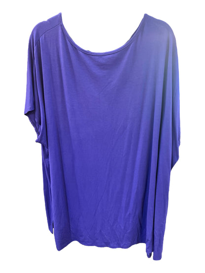 Loose-fitting, short-sleeved purple tunic with wide neckline and relaxed drape. Available in sizes XS-XXL.