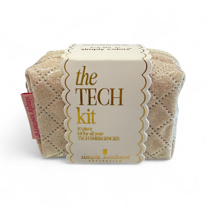Small glittery gold quilted tech pouch with pink tag, scalloped "the TECH kit" label; one size.