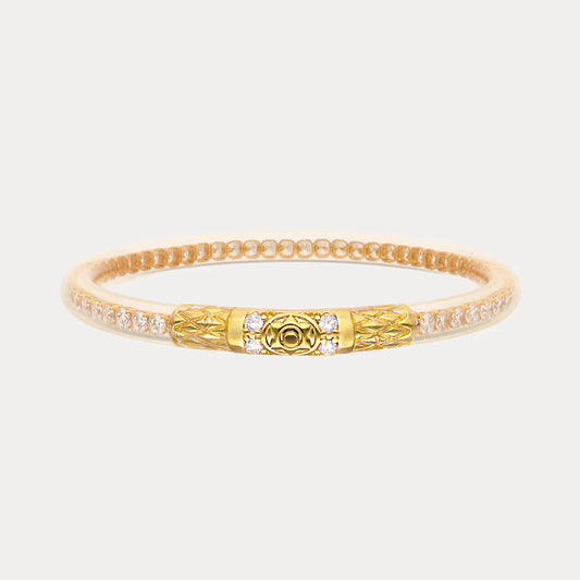 Handcrafted gold bangle with clear crystals and a textured, patterned clasp. Available in S, M, L sizes.