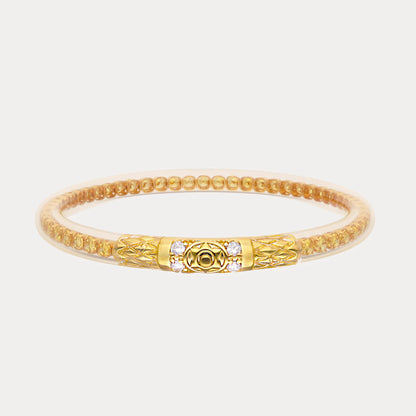 Gold-toned beaded bracelet with ornate central clasp, small gemstones. Available sizes: S, M, L.