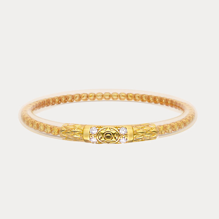 Gold-toned beaded bracelet with ornate central clasp, small gemstones. Available sizes: S, M, L.