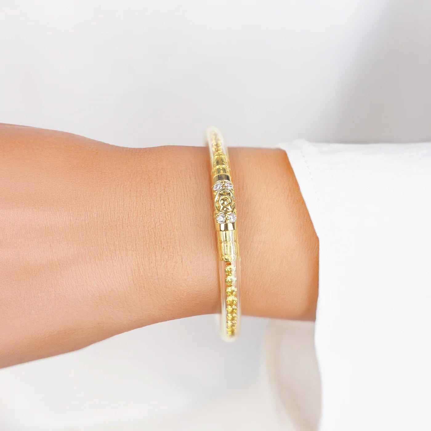Queen All Weather Bangles® | Yellow Rose & Gold—slim, textured gold-toned bangles with lotus bead, available in S-L sizes.