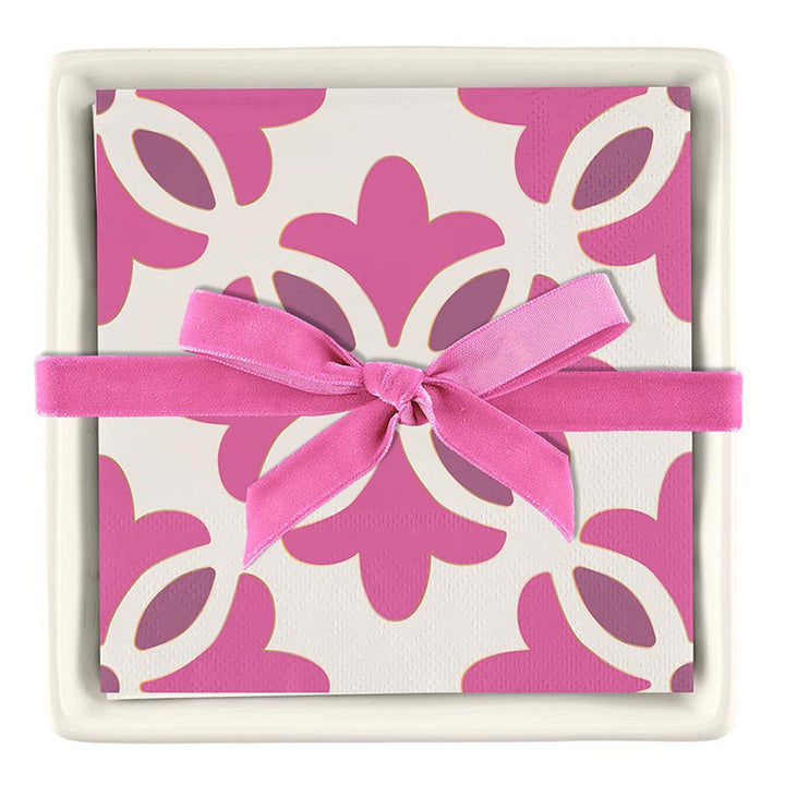 Ceramic Napkin Tray + Napkins Set: Includes a tray with paper cocktail napkins in a pink and white floral pattern, tied with a pink ribbon. Sizes available may vary based on the retailer.
