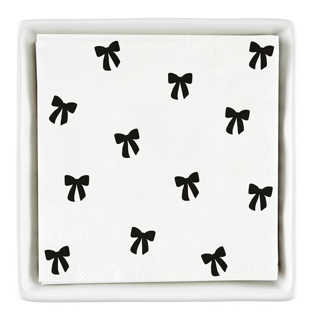 The Ceramic Napkin Tray + Napkins Set includes a ceramic tray with white cocktail napkins featuring black bows. Size: Standard cocktail napkin size.