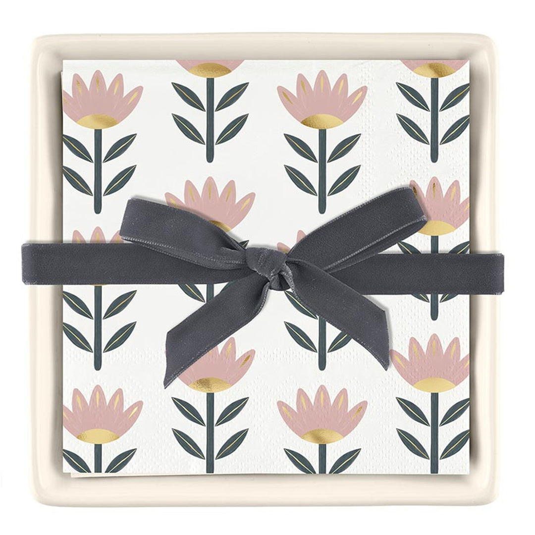 Set of pink and green floral paper cocktail napkins in an off-white ceramic tray; standard size napkins.