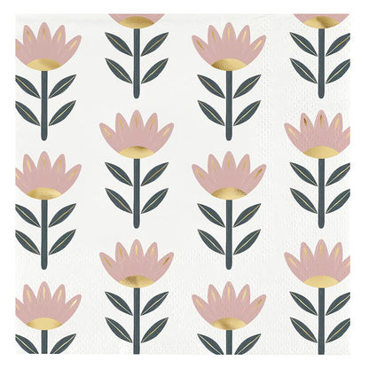 The Ceramic Napkin Tray + Napkins Set features stylized pink flowers with gold centers and dark green leaves on a white background, offering a sophisticated look. Available sizes: one size.