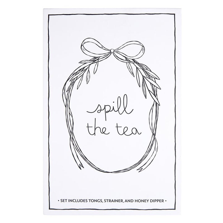The "Tea Essential Book Box - Spill The Tea" is a charming set featuring a tea-themed print with black and white wreath illustration. It includes tea bag tongs, a tea infuser strainer, and a honey dipper. Available sizes: N/A.