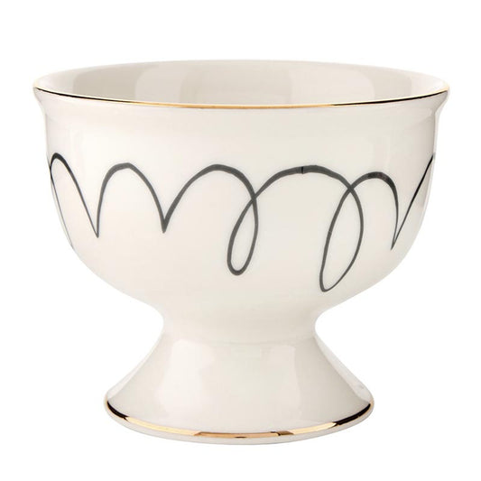 The Ceramic Ice Cream Bowl - Squiggles is a white pedestal bowl featuring a gold rim and black squiggly line design. Sizes available: One size.