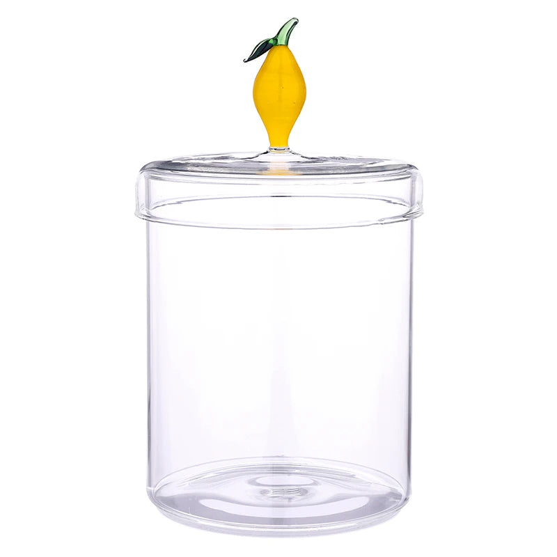 Clear cylindrical glass canister with a lid featuring a small yellow lemon-shaped handle and green leaf; available in multiple sizes.