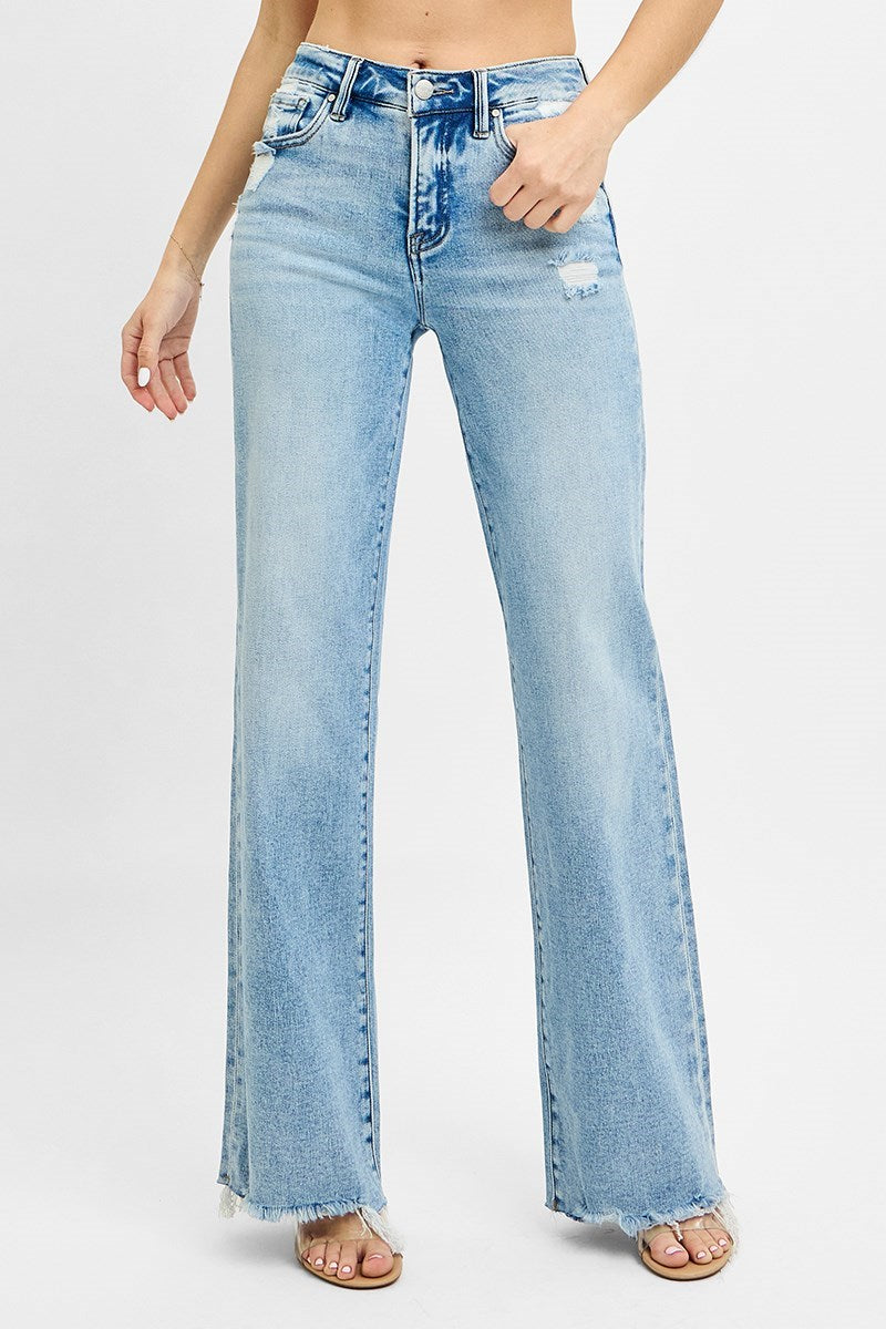Risen Tummy Control MR Wide Leg Jeans in light blue with raw edge hem, slight distressing. Available in sizes S-XL.