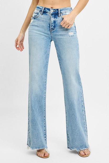 Risen Tummy Control MR Wide Leg Jeans in light blue with raw edge hem, slight distressing. Available in sizes S-XL.