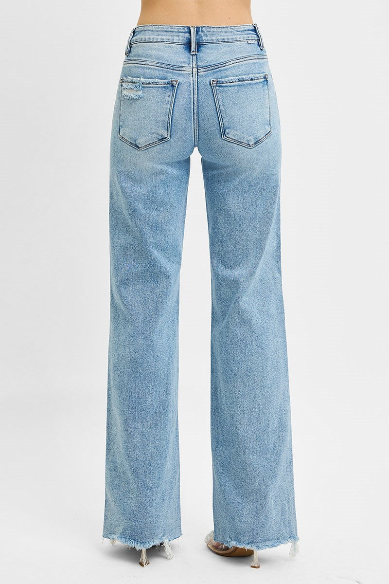 Risen Tummy Control MR Wide Leg Jeans in light blue with high waist, wide legs, raw hems, back pockets. Available in S-XL.