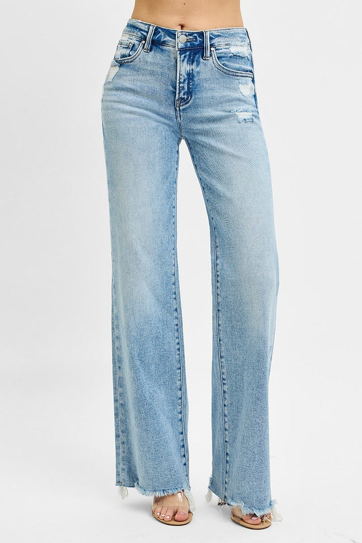 Risen Tummy Control MR Wide Leg Jeans, light wash, distressed details, raw edge hem. Available in sizes S-XL.