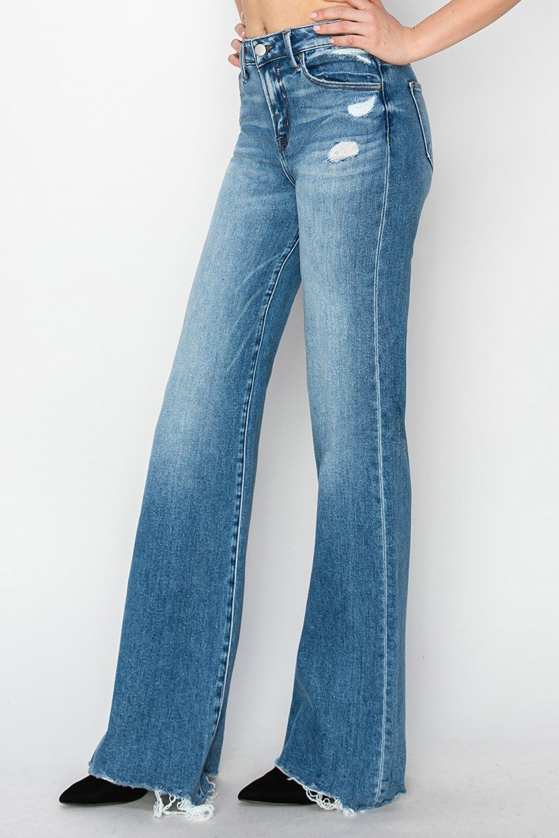 Risen Tummy Control MR Wide Leg Jeans in light blue with high waist, distressed details, raw hem, pockets. Sizes: 0-22.