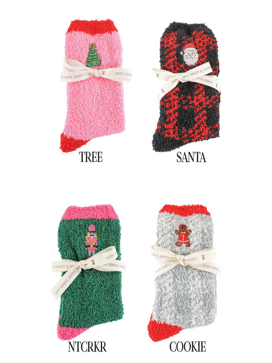 Four pairs of Soft-n-Cozy Fuzzy Holiday Socks, available in one-size-fits-most.