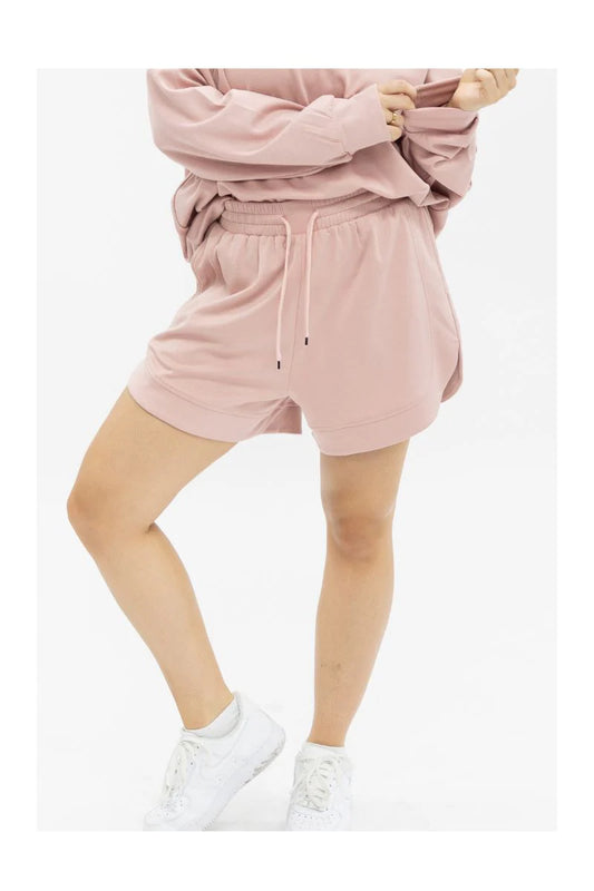 Pink Butter Soft Shorts with elastic waistband. Available in sizes XS-XL.