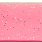Consuela Slim Wallet, Shine: Pink zippered pouch with shiny, small star-shaped confetti. Features 12 card slots. Available sizes: standard.