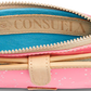 Consuela Slim Wallet, Shine in neon pink patent star glitter. Features a top zipper, blue fabric interior, and visible brand label. Includes front leather pocket and 12 card slots for organization. Available Size: One Size.