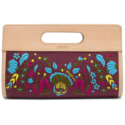 Dark maroon rectangular clutch with multicolor floral embroidery, tan leather handle, and “Consuela” emboss. Sizes: One size.