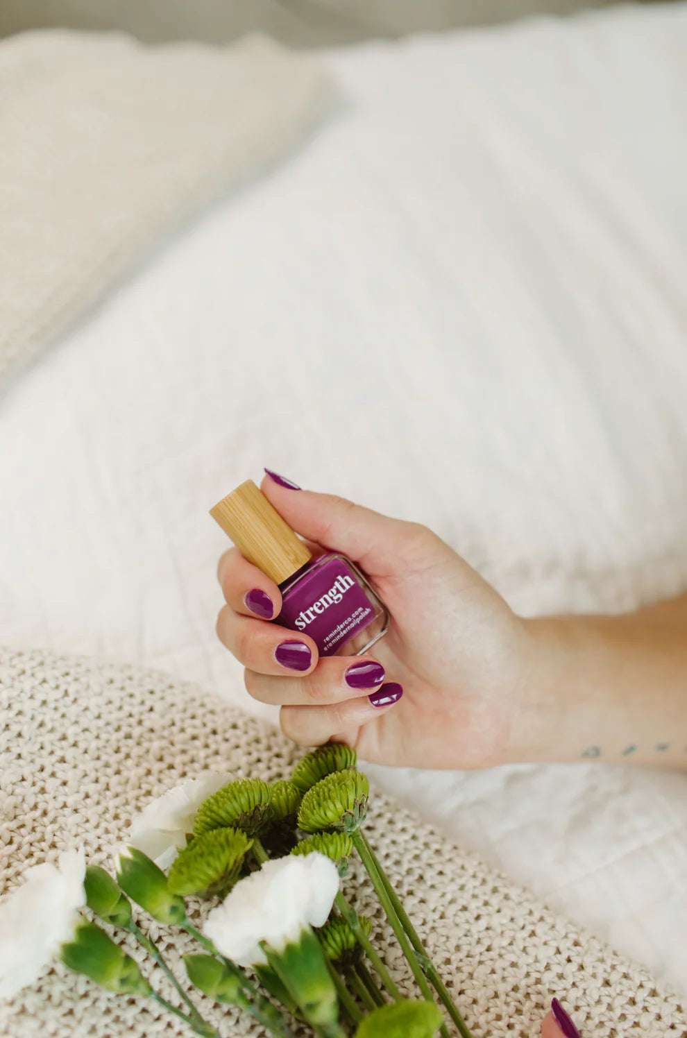 'Strength' violet purple nail polish bottle; concise, vibrant color. Sizes: 10ml, 15ml.