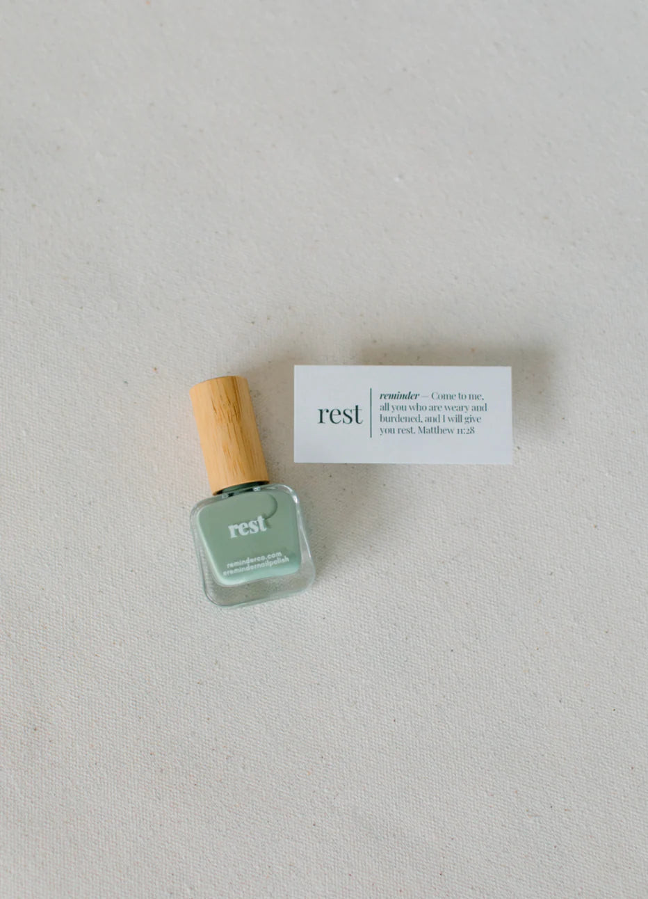 'Sage green "rest" nail polish with wooden cap; available in 10ml and 15ml sizes.'.