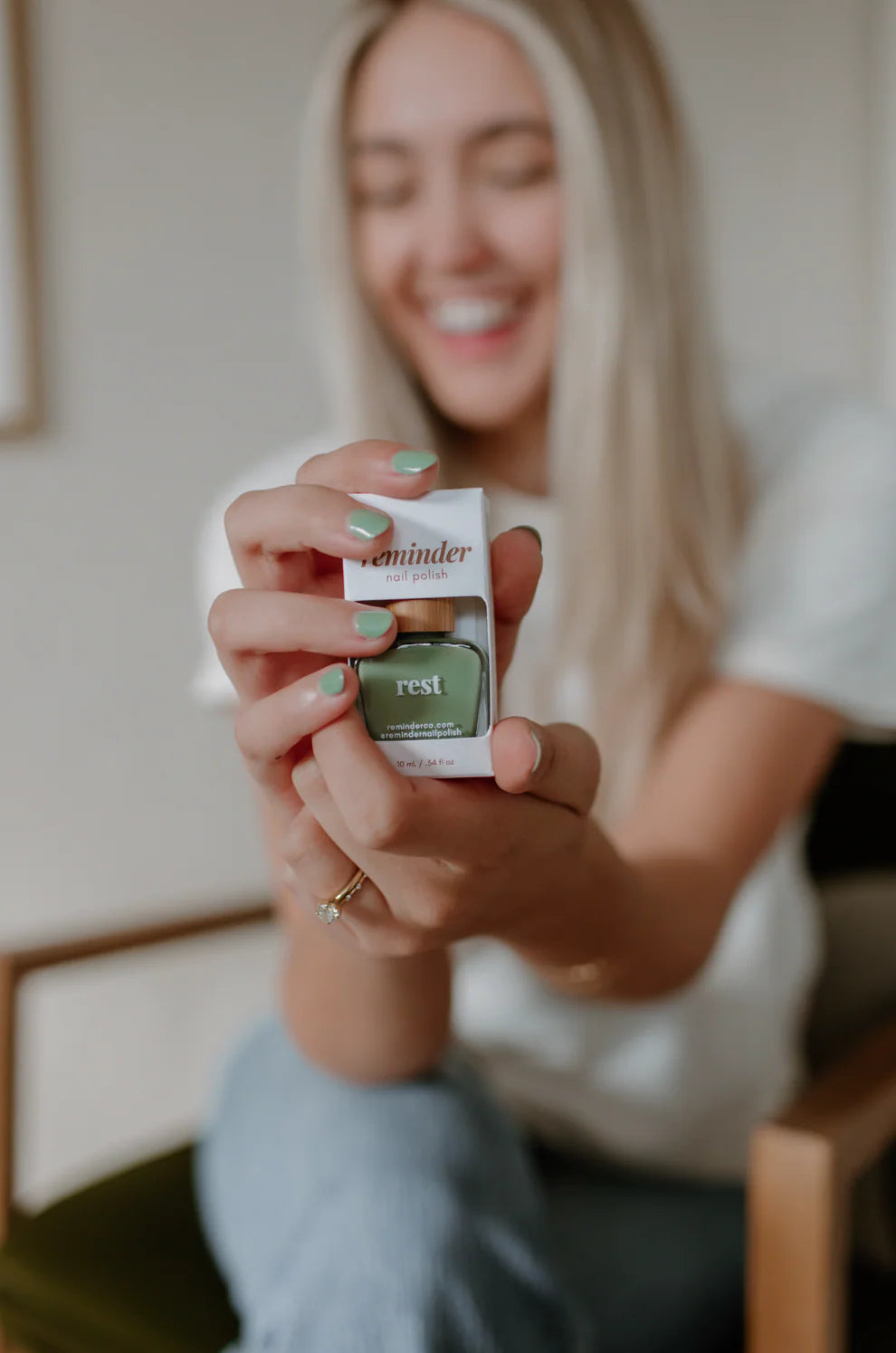 Box labeled "'rest' sage green nail polish | reminder nail polish." Available in standard and mini sizes. Sage green shade.
