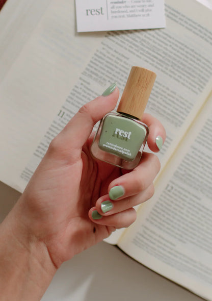 Sage green 'rest' reminder nail polish bottle shown; available in 10ml and 15ml sizes.