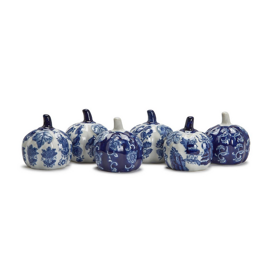 A row of six Blue and White Hand Painted Pumpkins with intricate blue and white floral and landscape patterns on a white background.