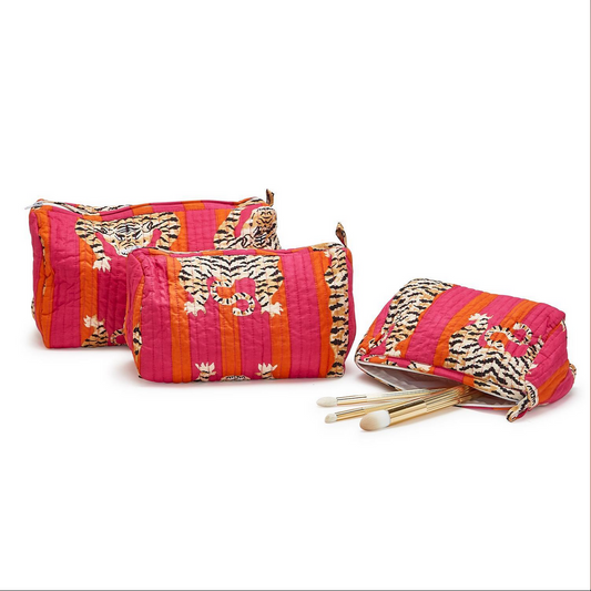 Three colorful Eye of the Tiger Bold Hand Block Printed Cotton Quilted Cosmetic and Accessory Bags. Decorated with vibrant orange, pink, and red stripes and tiger patterns. Zipper closures. Waterproof lining in smallest bag. Sizes available: Small, Medium, Large.