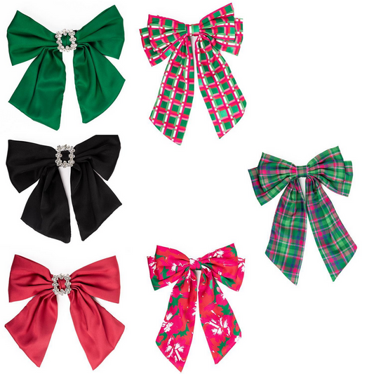 Holiday Bows set includes six festive bows. Sophisticated green, black, and red satin bows with gem accents. Charming red plaid bow, green plaid bow, and vibrant red bow with white-leaf patterns. Sizes available: Small, Medium, Large.