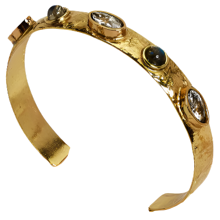 The Understated Natural Stone Accented Adjustable Cuff is a gold textured bangle bracelet with oval and round gemstones. It has an open-ended design, a slightly uneven surface, and a clasp on one end for securing it. Gems are set in individual bezels around the band. Available in one adjustable size.