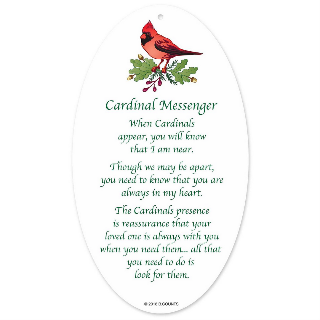 Oval acrylic cardinal ornament with cardinal and holly illustration and “Cardinal Messenger” poem.