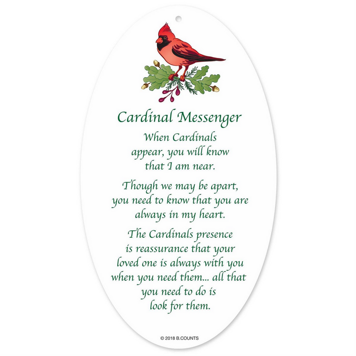 Oval acrylic cardinal ornament with cardinal and holly illustration and “Cardinal Messenger” poem.
