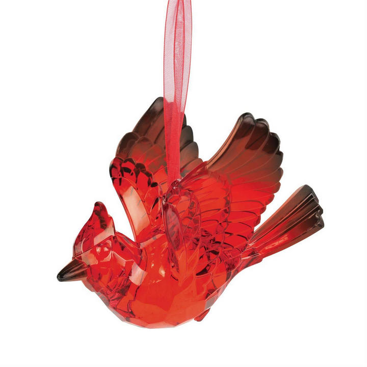 Red translucent acrylic cardinal ornament with wings spread on a red ribbon.