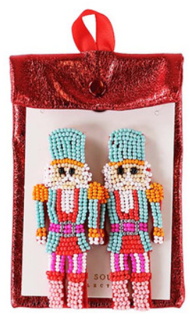 Nutcracker-shaped beaded holiday earrings in a red metallic pouch.