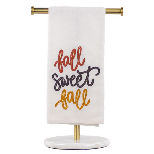 The Fall Sweet Fall Hand Towel features embroidered "fall sweet fall" text in red, black, and gold. Sizes: One Size.