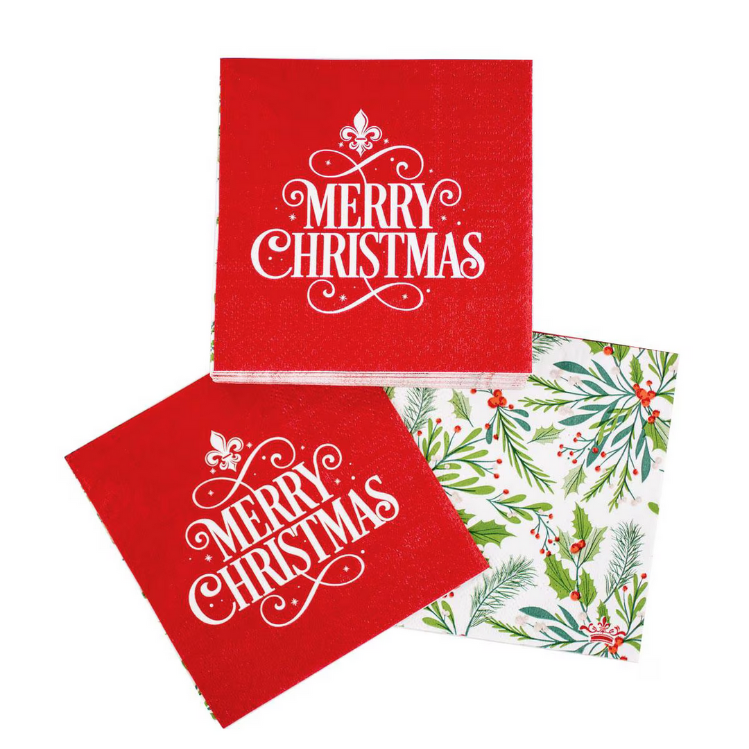 Two red Fleur Merry Christmas cocktail napkins with white “Merry Christmas” text, and one botanical pattern napkin.