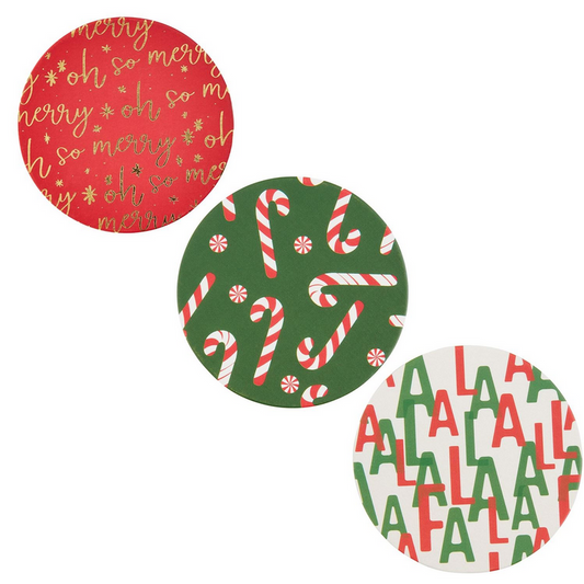 Set of three round festive coasters: red "so merry" with gold and white cursive writing, green with candy cane pattern, and white "FA LA LA" in green and red. Available sizes: One size only.