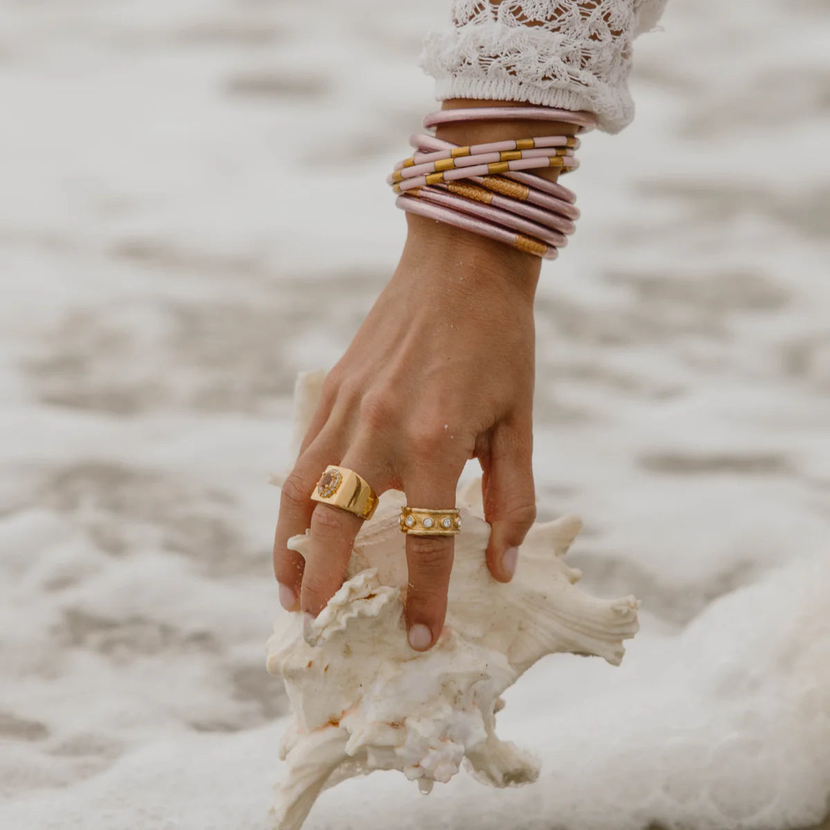 Ice Rose Veda Stack—delicate stacked rings in sizes 5-9, silver with rose accents, worn on hand.
