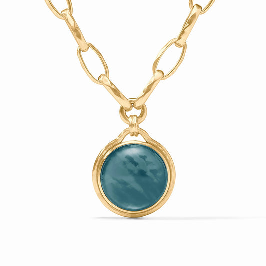 Solara Statement Necklace features 24K gold-plated oval links and iridescent blue pendant. Available in standard length.