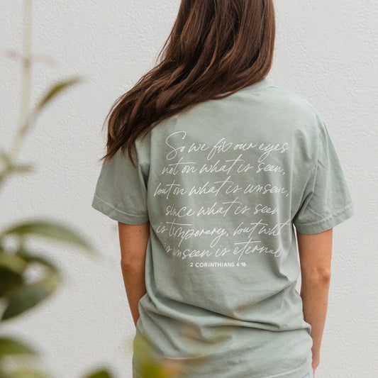 Eyes on Eternity Tee with 2 Corinthians 4:18 in white script on back. Available in sizes S-XXL.