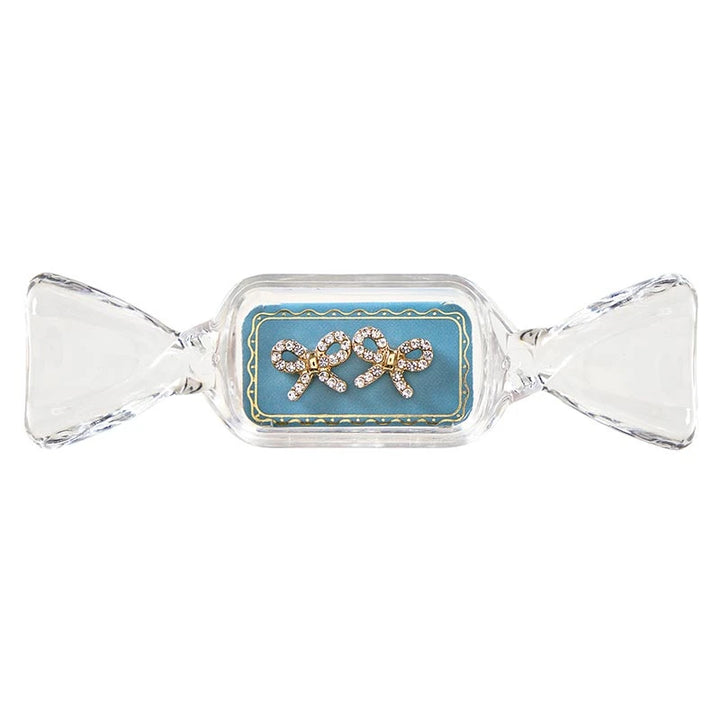 Sweet &amp; Sparkly rhinestone bow stud earrings in a candy-shaped container.