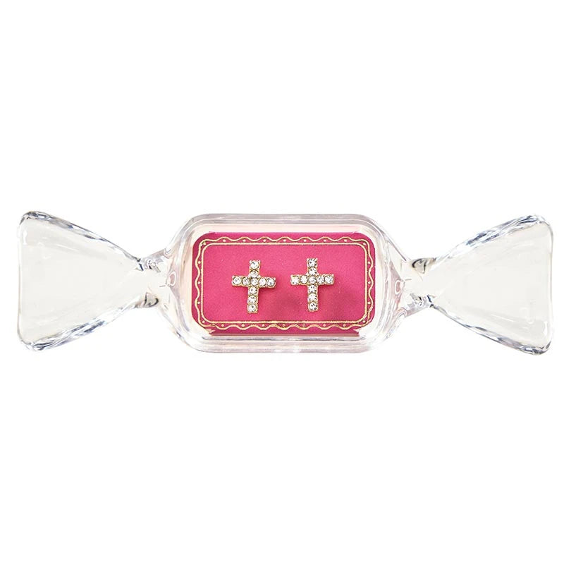 Sweet &amp; Sparkly rhinestone-studded cross stud earrings in a pink, candy-shaped container.