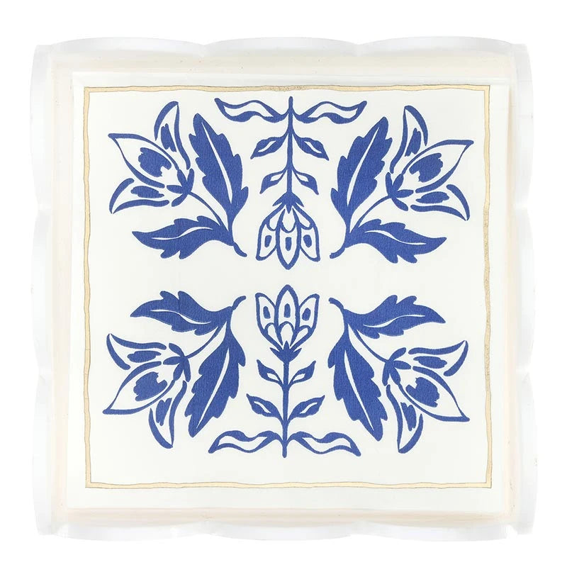 Acrylic cocktail napkin tray with white napkins featuring scalloped edges, a blue damask floral pattern, and a thin gold border. Available in standard cocktail napkin size.