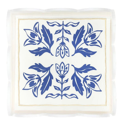 Acrylic cocktail napkin tray with white napkins featuring scalloped edges, a blue damask floral pattern, and a thin gold border. Available in standard cocktail napkin size.