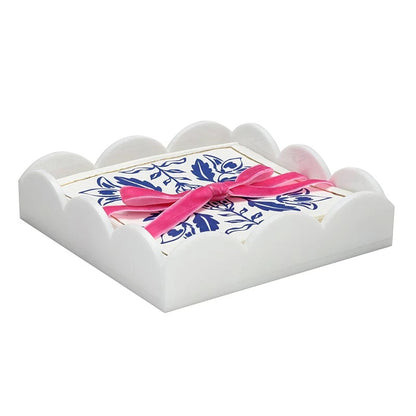 Acrylic cocktail napkin tray in Damask pattern with white scalloped-edge design, includes floral napkins tied with a pink ribbon. Available in standard cocktail napkin size.