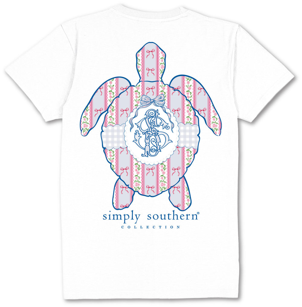 White Simply Southern Coquette Logo Turtle T-Shirt with pink/blue sea turtle graphic, monogram, text. Sizes: S-XXL.