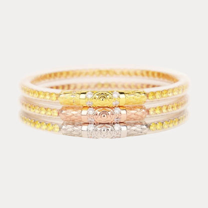 Three interlocked bangles in gold, rose gold, and silver with detailed design and ornate clasps. Available in sizes S, M, L.