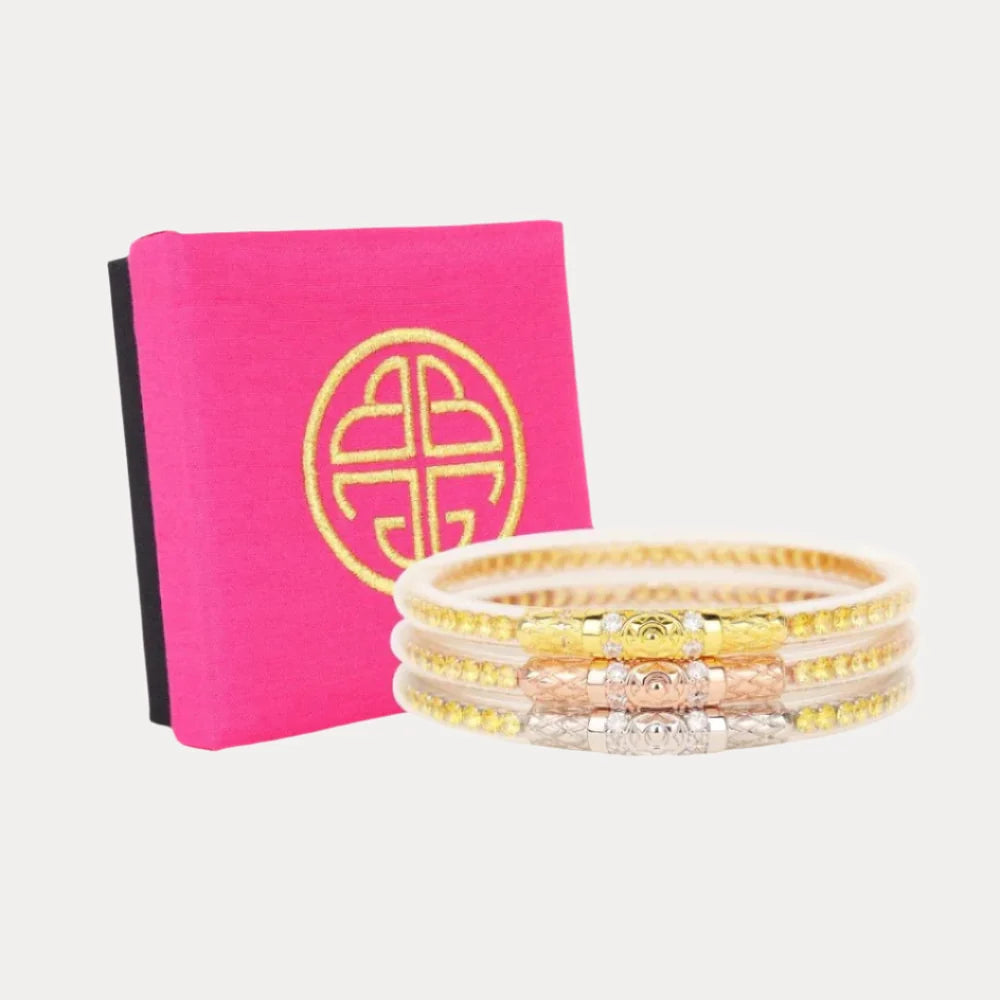 Three Queens All Weather Bangles | Yellow Rose: three gold-toned, textured bracelets including a yellow rose bangle; available in multiple sizes.
