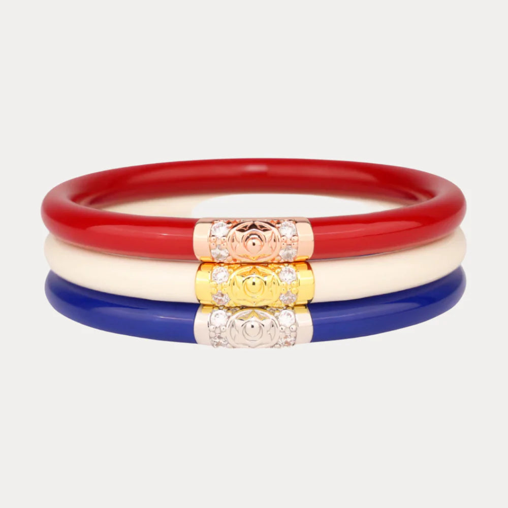 America Three Kings AWB® Stack: three smooth bangles in red, white, and blue with floral clasps; sizes S, M, L available.